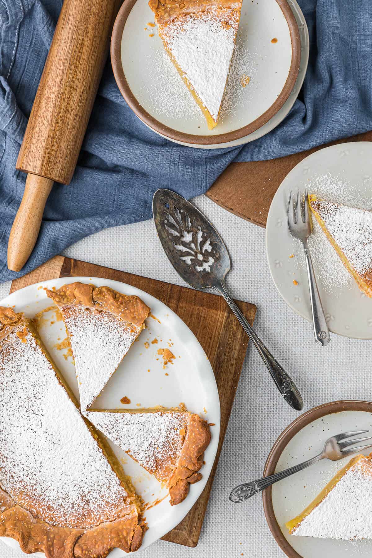 Overhead of chess pie with pieces cut out on plates.