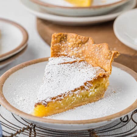 A slice of chess pie on a plate.