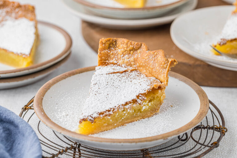A slice of pie on a plate.