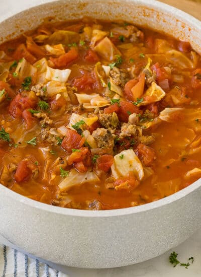 Sausage and cabbage soup in a pot.