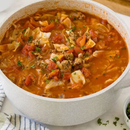 Sausage and cabbage soup in a pot.