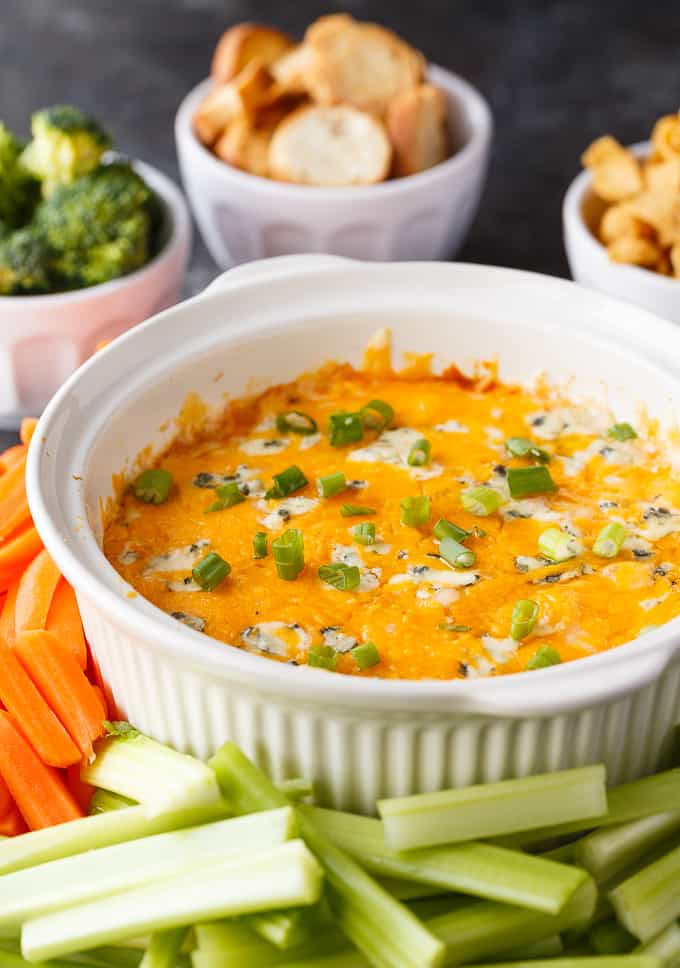 Buffalo Chicken Dip - A low-carb snack that packs a punch! This delicious dip is perfect for keto and filled with chicken, ranch, buffalo sauce, and so many cheeses.