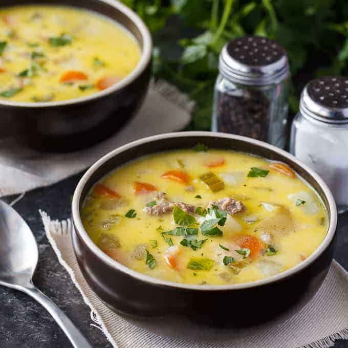 Cheeseburger Chowder - The best comfort food to warm your bones! This creamy, cheesy soup is filled with ground beef, potatoes, carrots, celery, and Velveeta cheese.