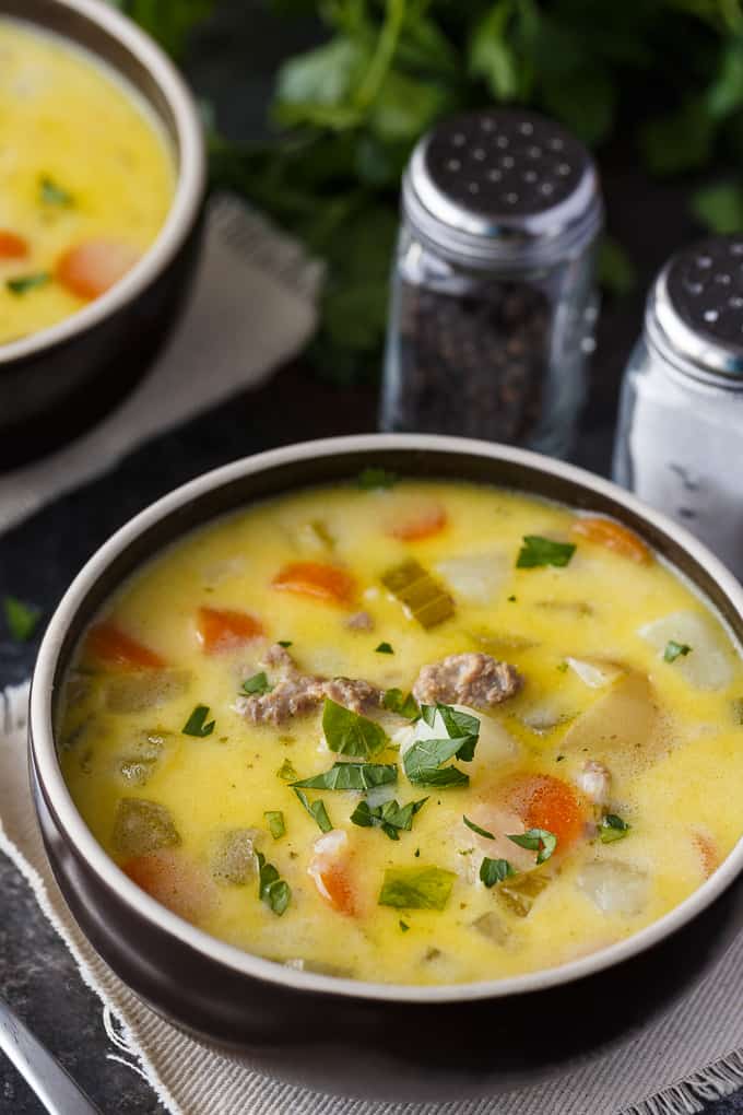 Cheeseburger Chowder - The best comfort food to warm your bones! This creamy, cheesy soup is filled with ground beef, potatoes, carrots, celery, and Velveeta cheese.