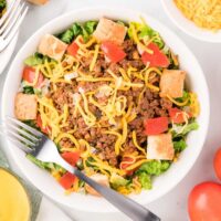 A bowl of Cheeseburger Salad with a fork.