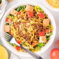 A bowl of Cheeseburger Salad with a fork.