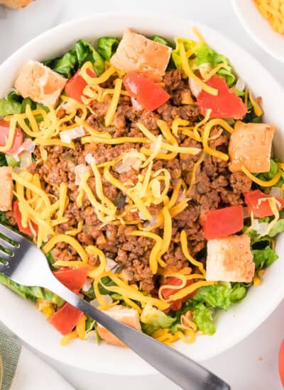 A bowl of Cheeseburger Salad with a fork.