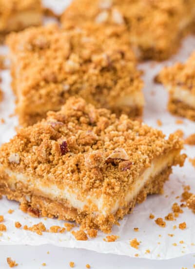 Butterscotch Cheesecake Bars on parchment paper.