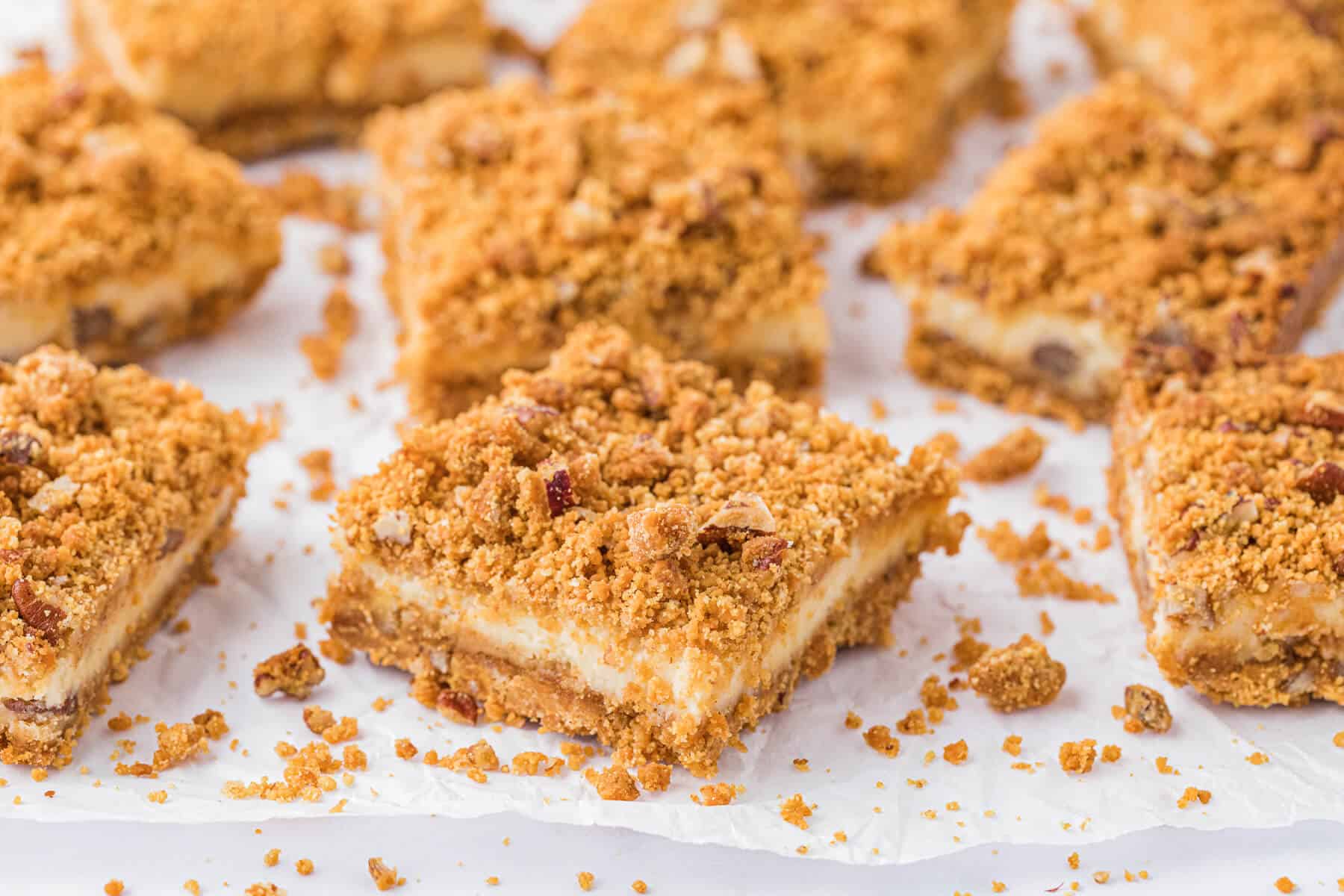 Butterscotch Cheesecake Bars on parchment paper.