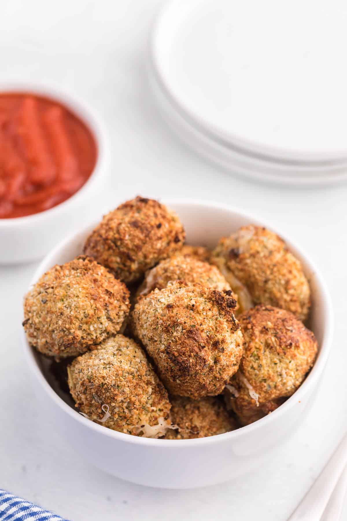 Air Fryer Mozzarella Balls - These homemade cheeseballs are bite sized, super seasoned, and air fried in minutes! A great make-ahead snack or appetizer.