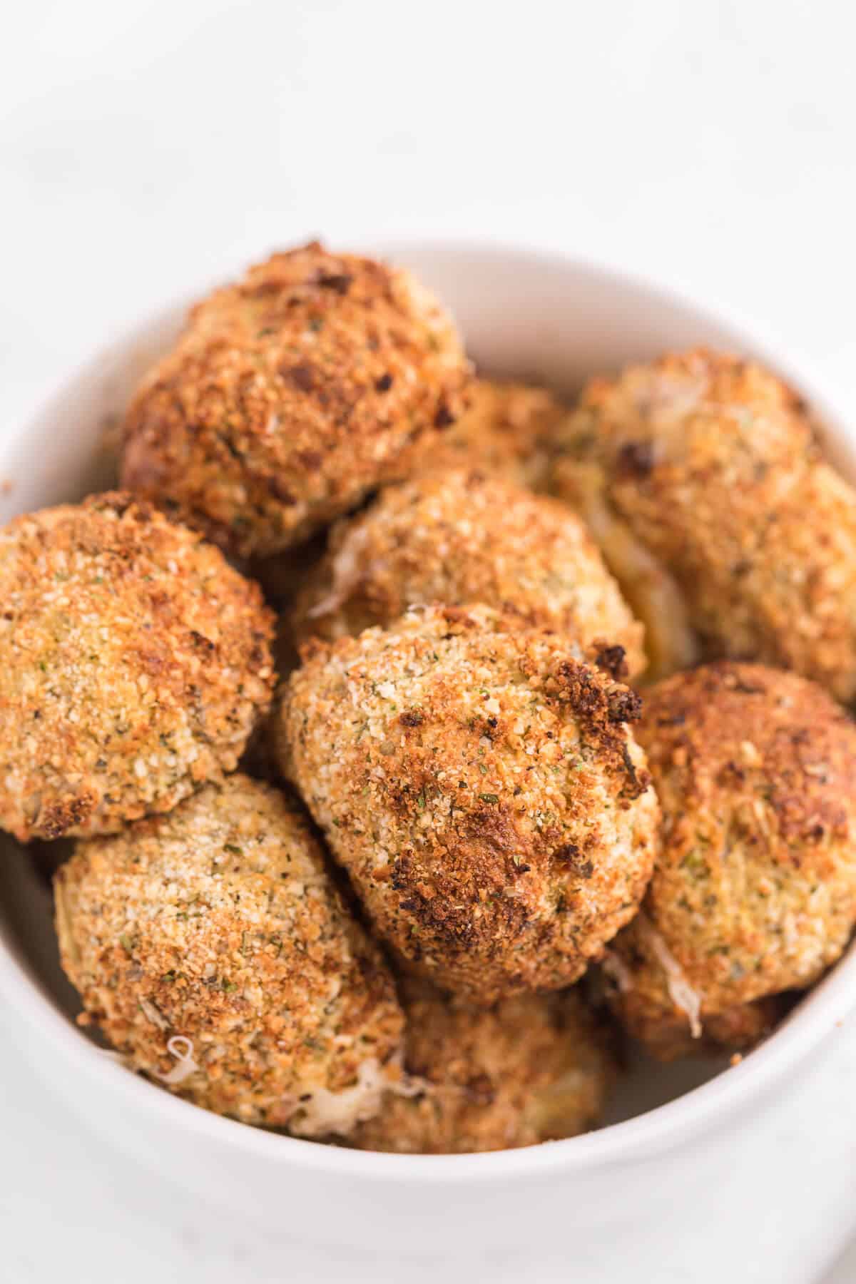 Air Fryer Mozzarella Balls - These homemade cheeseballs are bite sized, super seasoned, and air fried in minutes! A great make-ahead snack or appetizer.