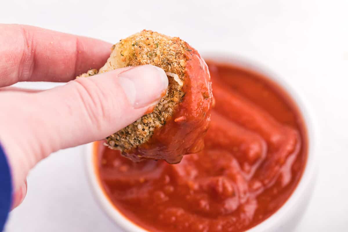Air Fryer Mozzarella Balls - These homemade cheeseballs are bite sized, super seasoned, and air fried in minutes! A great make-ahead snack or appetizer.