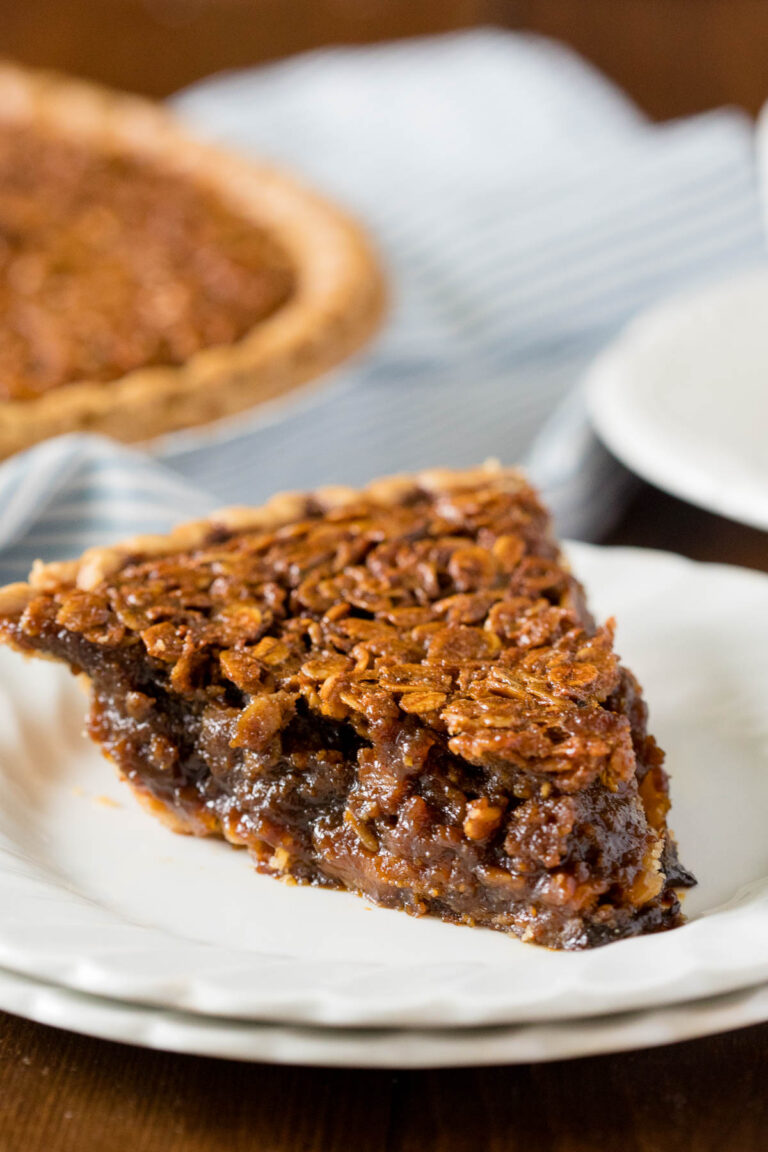 A slice of pie on a white plate.