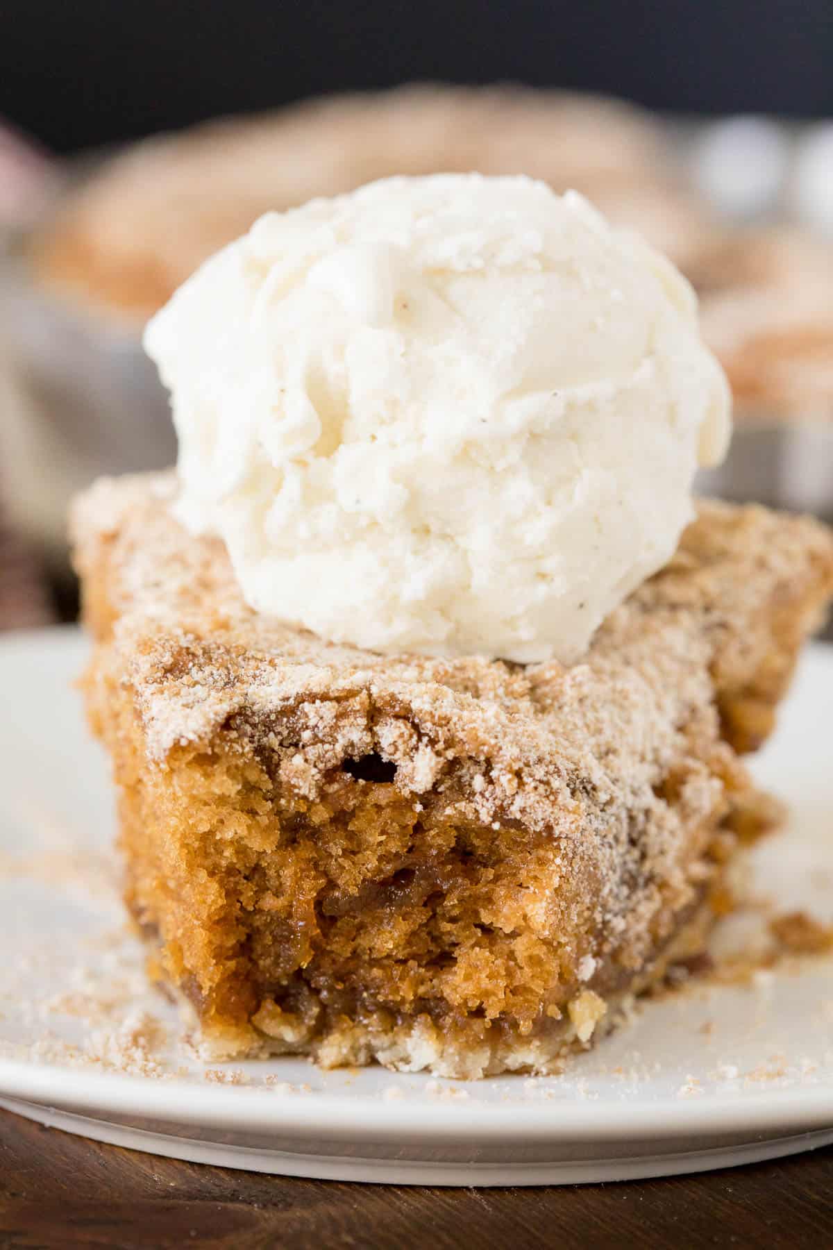 A slice of pie with a bite off the end.