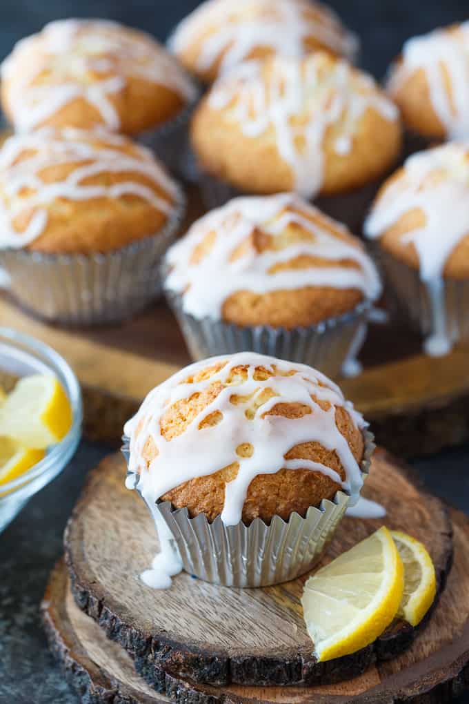 Lemon Pound Cake Muffins - The perfect accompaniment to your morning coffee! These muffins are dense and moist and drizzled with a sweet, tangy lemon glaze.