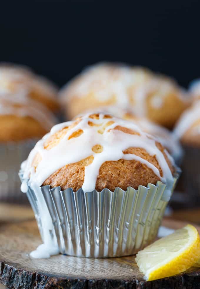 Lemon Pound Cake Muffins - The perfect accompaniment to your morning coffee! These muffins are dense and moist and drizzled with a sweet, tangy lemon glaze.