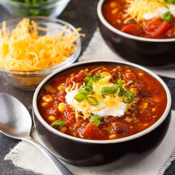 Taco Chili - The best Taco Tuesday recipe for soup season! Make this chunky taco soup with black beans, corn, green chiles, and a dollop of sour cream on top.