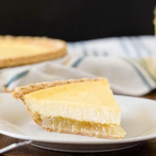 Pineapple Pie - A creamy, tropical pie with a twist. This easy dessert is filled with cream cheese, vanilla, and pineapple chunks!