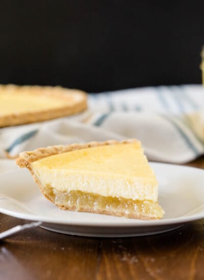 Pineapple Pie - A creamy, tropical pie with a twist. This easy dessert is filled with cream cheese, vanilla, and pineapple chunks!