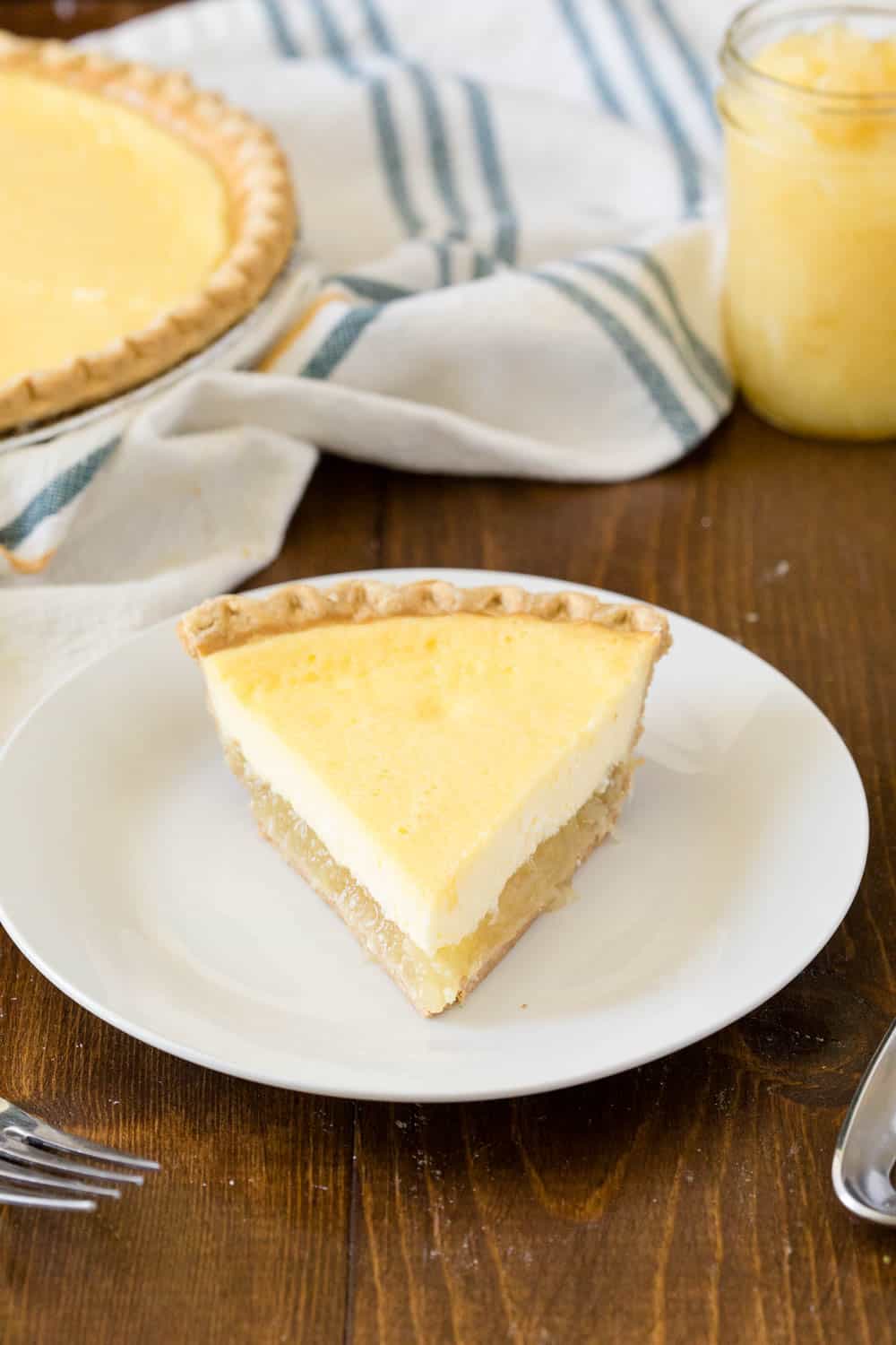 Pineapple Pie - A creamy, tropical pie with a twist. This easy dessert is filled with cream cheese, vanilla, and pineapple chunks!