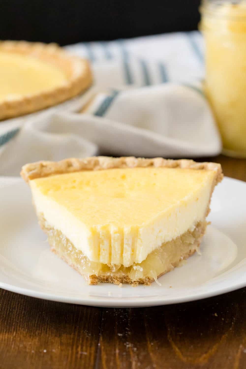 Pineapple Pie - A creamy, tropical pie with a twist. This easy dessert is filled with cream cheese, vanilla, and pineapple chunks!