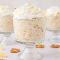Pineapple pretzel fluffs in parfait dishes.