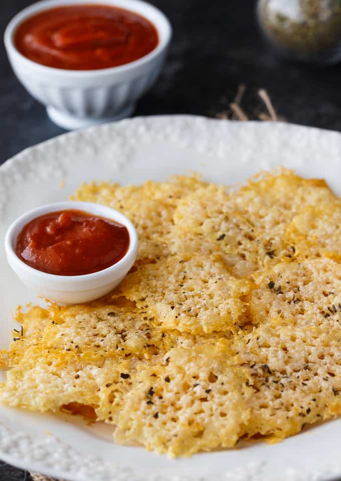 Parmesan Crisps - The perfect low carb snack! This easy recipe is guilt-free and delicious. Enjoy as an appetizer, in soup or salads or even as the bread for your sandwich.