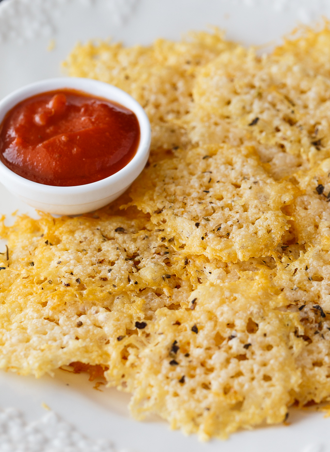 Parmesan Crisps - The perfect low carb snack! This easy recipe is guilt-free and delicious. Enjoy as an appetizer, in soup or salads or even as the bread for your sandwich.