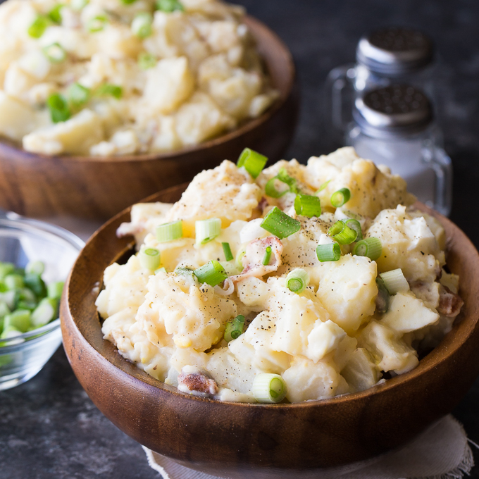 Dutch Potato Salad - My favorite side dish! Add hard boiled eggs, bacon and green onions to this tangy and super creamy potato salad.