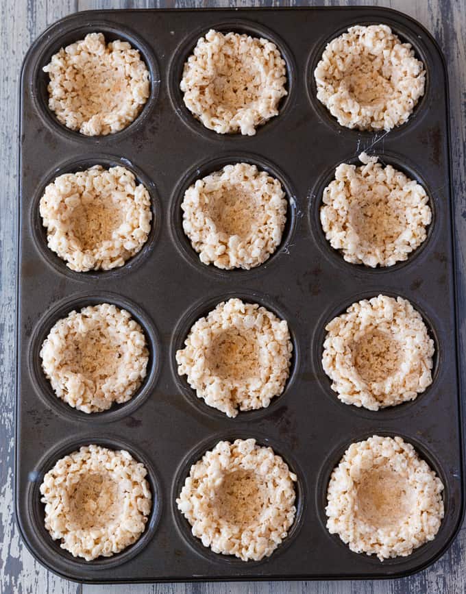 Krispie Easter Nests - This easy Easter dessert is fun to make and eat! Kids love to help decorate with colourful green grass and Easter chocolate and candy.