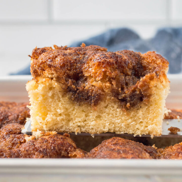 Grandma's cinnamon coffee cake slice on a cake pan.
