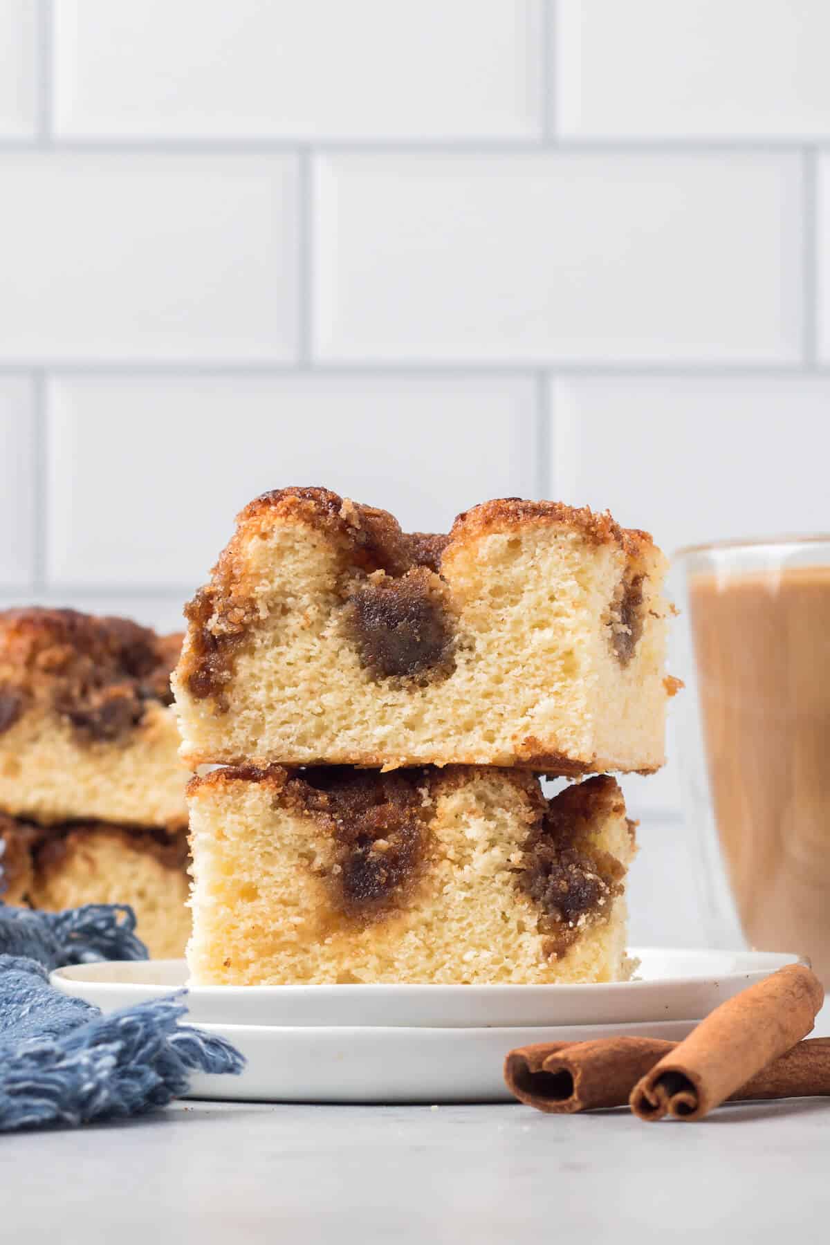 A stack of two pieces of cinnamon coffee cake.