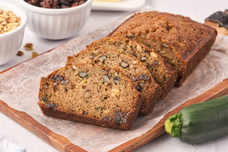 Slices of zucchini bread on a cutting board.