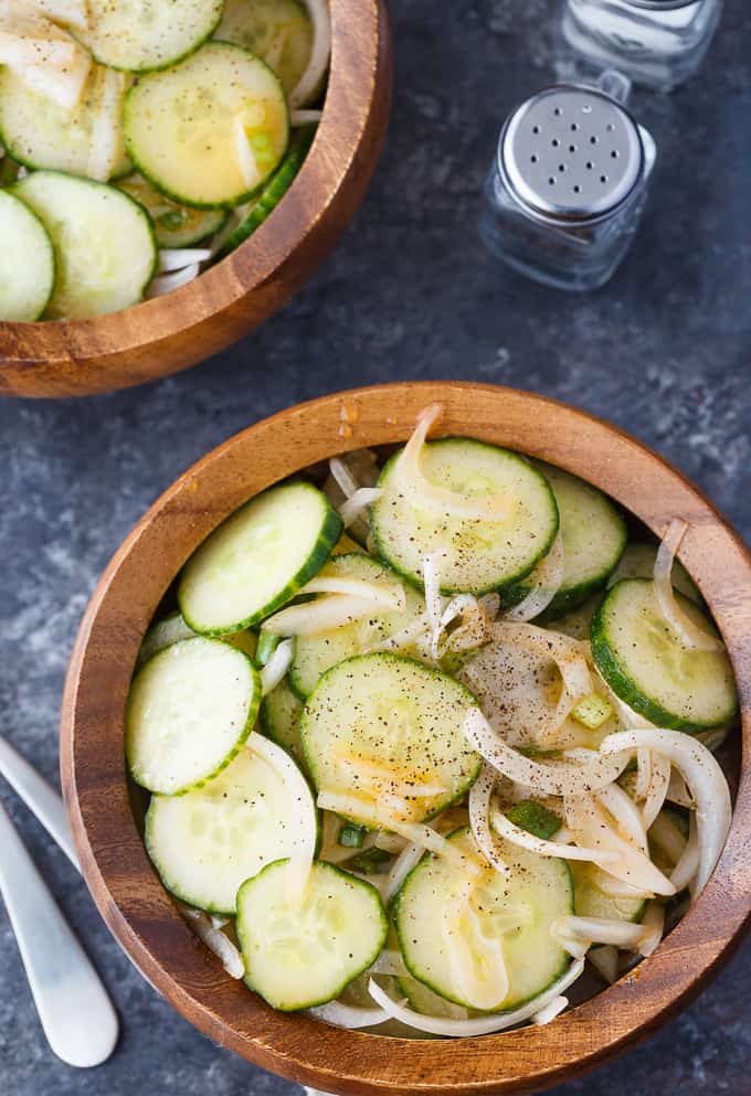 Cucumber Salad - Fresh, easy and so delicious! Each bite of this summer side dish is bursting with flavor of cucumbers, onions and a yummy vinegar dressing.