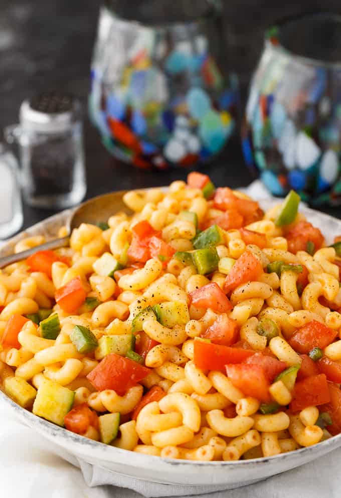 Macaroni Salad - A family favorite! The best tangy macaroni salad with an oil, vinegar, and ketchup dressing your kids will love.