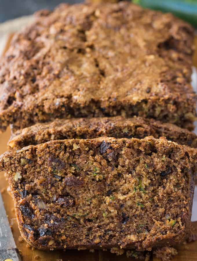 Zucchini Bread - A moist and delicious zucchini loaf for all the veggie haters! This sweet bread is filled with zucchini, raisins, walnuts, and cinnamon. It's my grandma's recipe.