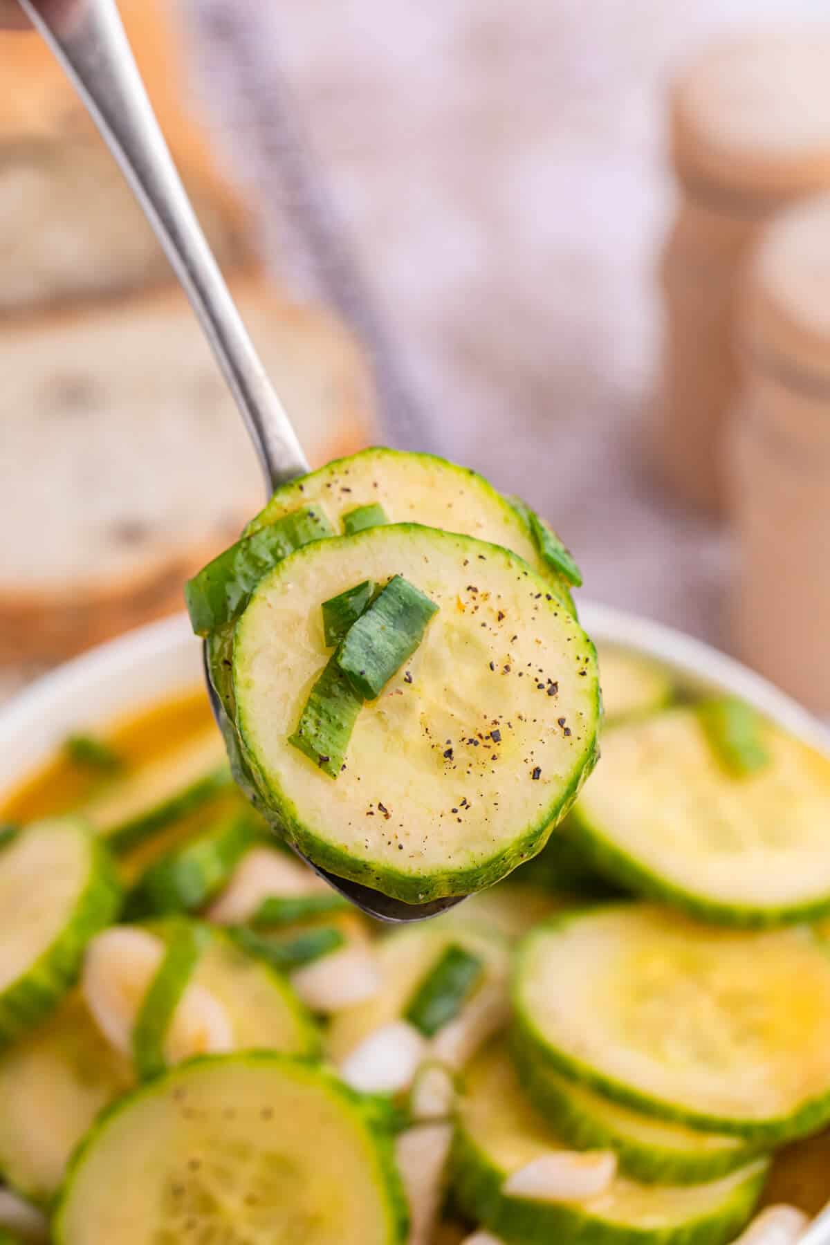 Cucumber salad on a spoon.