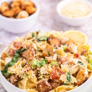 Chicken caesar pasta salad in a bowl.