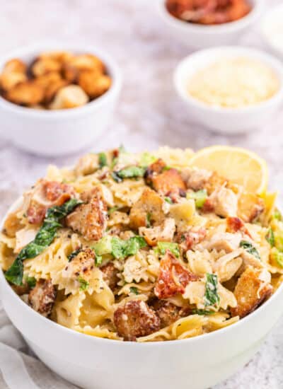 Chicken caesar pasta salad in a bowl.