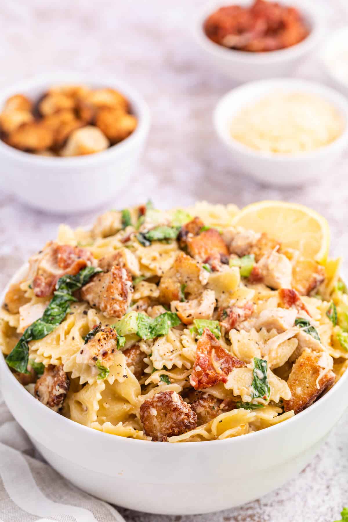 Chicken caesar pasta salad in a bowl.