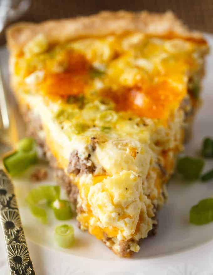 Hamburger Quiche - Dinner for breakfast! This quick and easy quiche is filled with all the flavors of a cheeseburger combined with fluffy scrambled eggs and veggies.