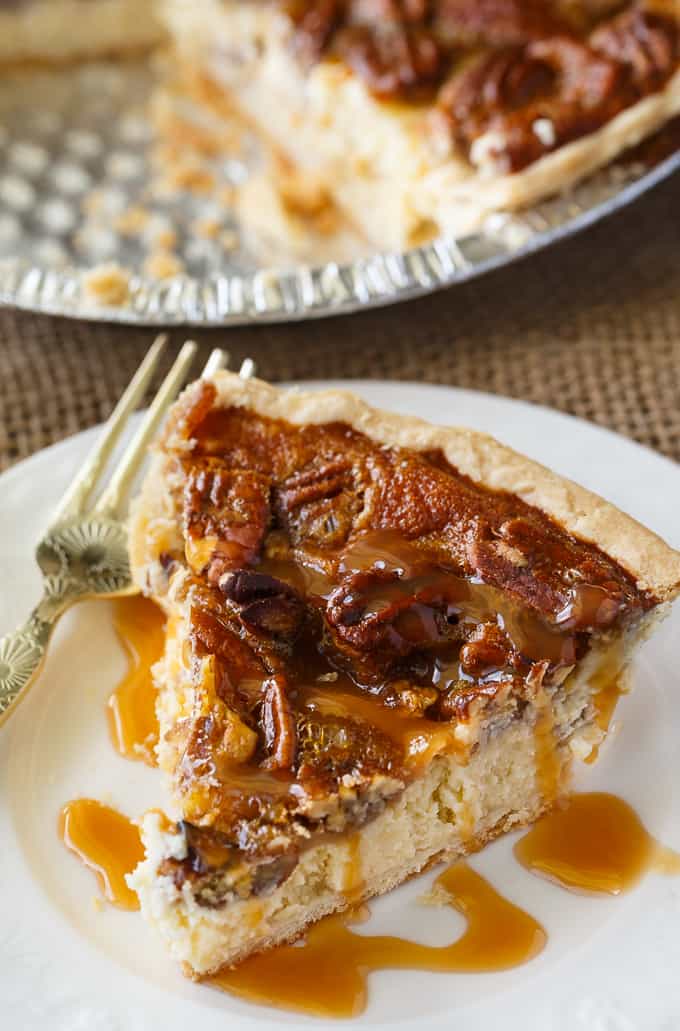 Pecan Pie Cheesecake - Creamy cheesecake filling is topped by a sweet layer of caramel pecans. This easy dessert recipe is one for the record books!