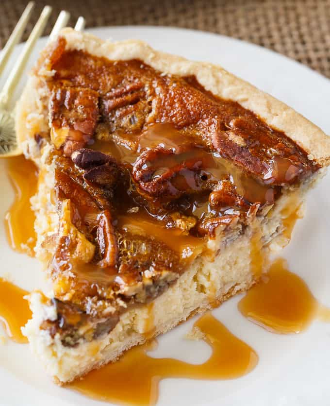 Pecan Pie Cheesecake - Creamy cheesecake filling is topped by a sweet layer of caramel pecans. This easy dessert recipe is one for the record books!