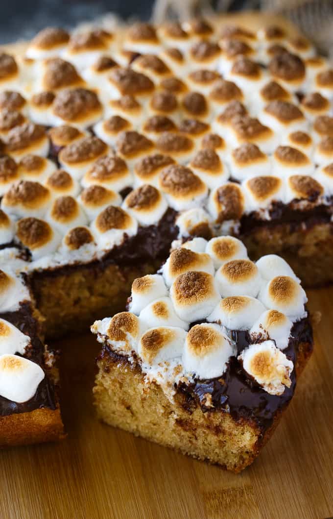 S'mores Cake - The epitome of summer! Bring the campfire indoors with this super simple, but decadent cake. It's incredibly moist, sweet with layers of graham cracker cake, rich chocolate and toasty marshmallows.