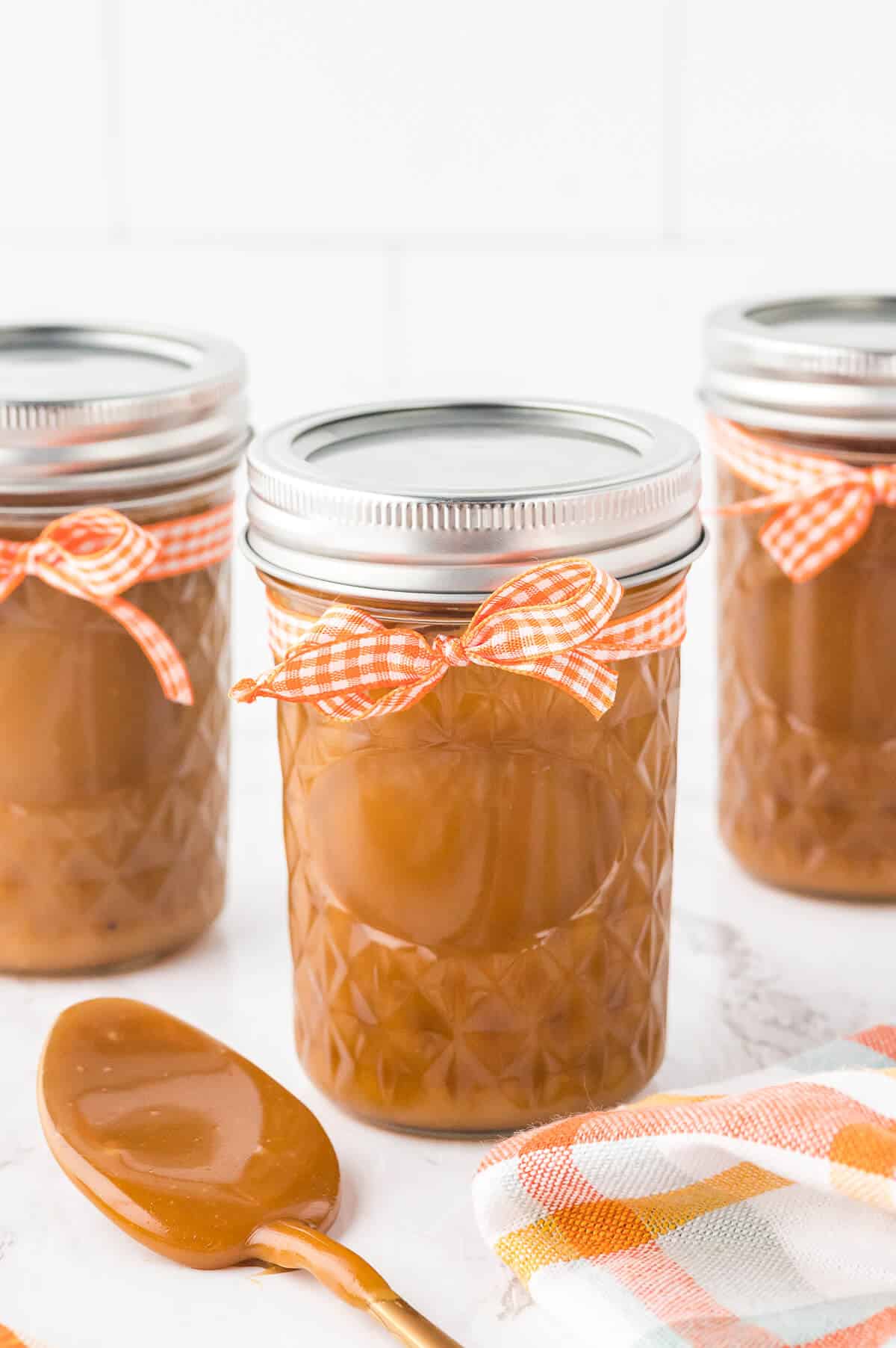 Jars of butterscotch sauce.