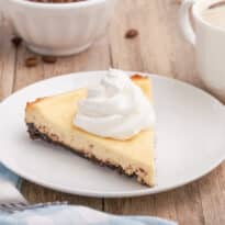 A slice of cappuccino cheesecake on a plate.