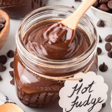 A jar of the recipe with a wooden spoon.