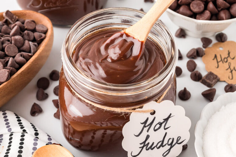 A jar of the recipe with a wooden spoon.