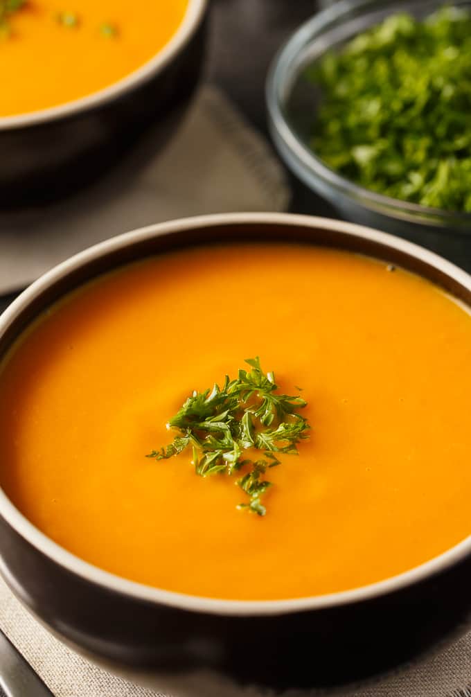 Cream of Carrot Soup - This creamy bisque recipe screams fall! This smooth, velvety soup with potatoes, celery, onions, and a little milk is so decadent, but super easy, too. Perfect for dinner parties!