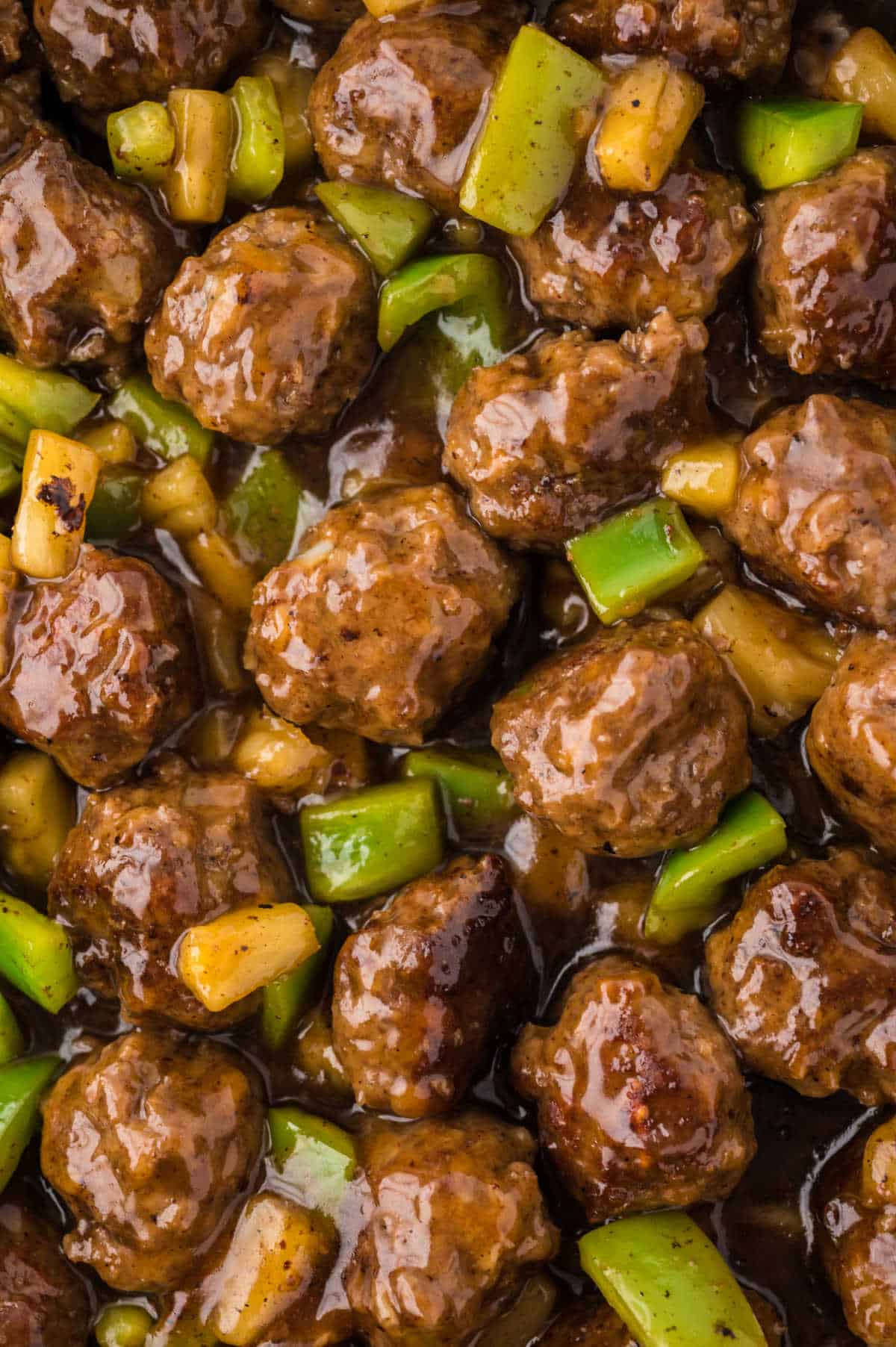 Close up of waikiki meatballs in a pan.